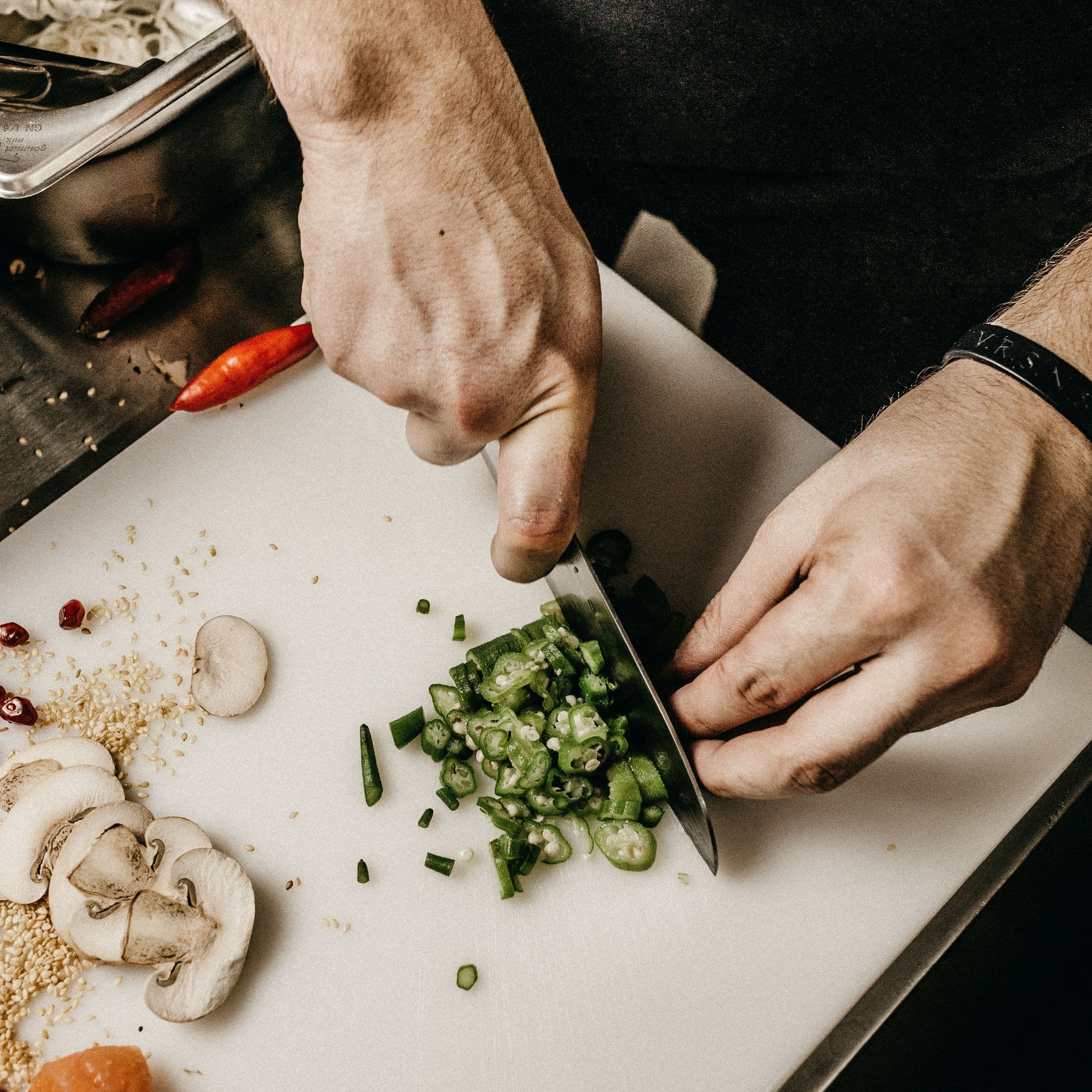 Chef slicing vegetables with a knife