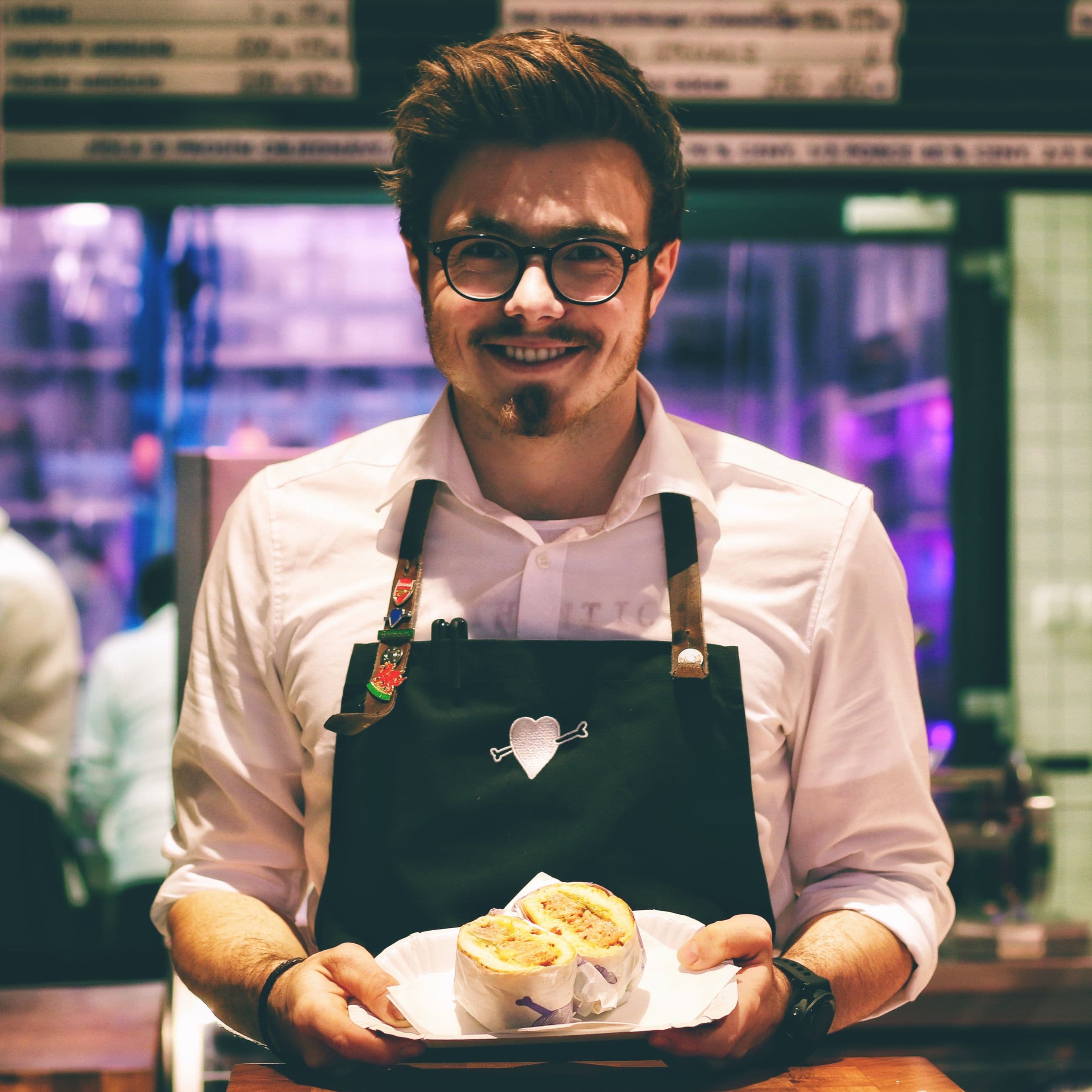 Waiter holding a plate with finished meal